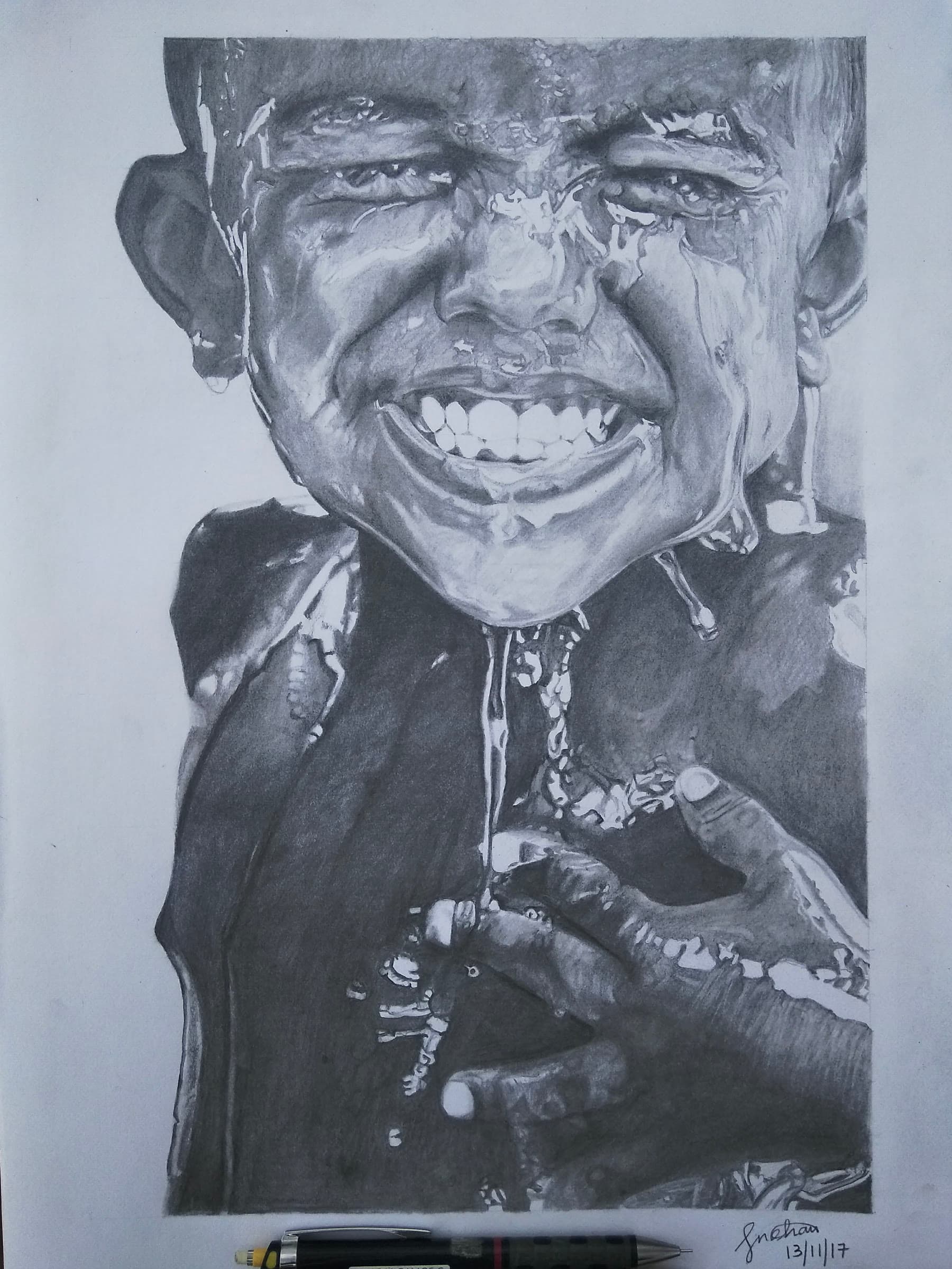Graphite drawing of a boy laughing with water running down his face